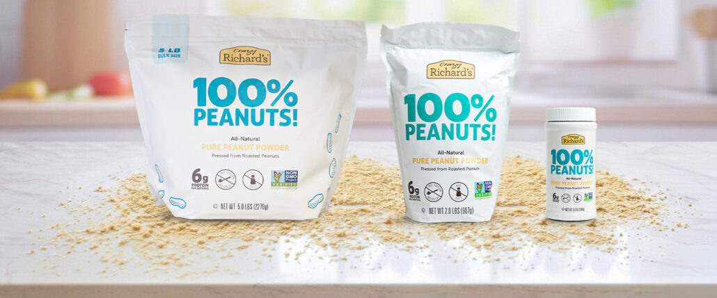 image of three sizes of Crazy Richard's 100% Peanuts Peanut Powder: 5lb, 2lb, and 6.5 oz
sitting on a white kitchen counter with peanut powder artfully scattered around the counter.